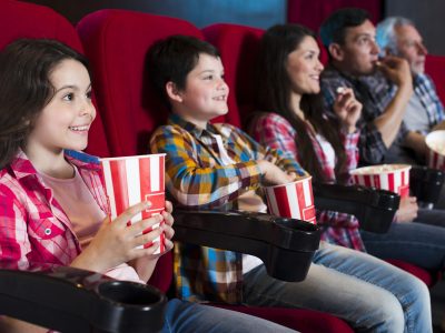 happy-family-sitting-cinema